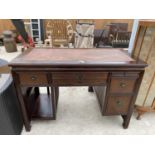 A MODERN CHINESE DOUBLE PEDESTAL DESK WITH INSET RATTAN TOP AND DRAWER FRONTS, 47" X 23.5"