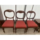 THREE VICTORIAN MAHOGANY BALLOON-BACK DINING CHAIRS