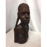 AN AFRICAN TRIBAL WOODEN CARVED BUST MODEL. H 30CM