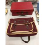 A SMALL RED CASE AND A SMALL BURGUNDY SCHOOL SATCHEL