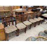 A SET OF SIX 18TH CENTURY STYLE LADDERBACK DINING CHAIRS WITH RUSH SEATS