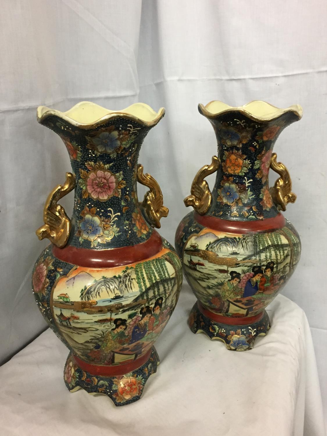 A PAIR OF GILT HANDLED HIGHLY DECORATIVE JAPANESE VASES MARKED TO BASE (ONE A/F) H-41CM