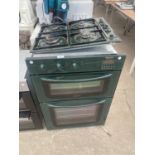 A GREEN HOTPOINT INTERGRATED COOL TOUCH DOUBLE OVEN