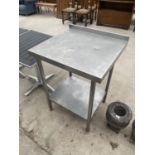 A SMALL SQUARE STAINLESS STEEL KITCHEN WORK SURFACE