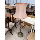 A MID 20TH CENTURY BRASS STANDARD LAMP COMPLETE WITH SHADE