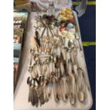 A LARGE COLLECTION OF SILVER PLATE AND EPNS TO INCLUDE SUGAR TONGUES, KNIFE RESTS, SPOONS, FORKS,