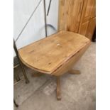 A MODERN PINE DROP-LEAF KITCHEN TABLE, 46" DIAMETER