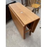 A RETRO TEAK DROP LEAF DINING TABLE