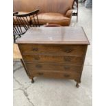 A MID 20TH CENTURY OAK CHEST OF FOUR GRADUATED DRAWERS, ON CABRIOLE LEGS, 28" WIDE