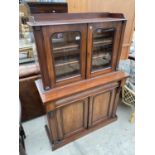 A VICTORIAN MAHOGANY TWO DOOR GLAZED BOOKCASE WITH GALLERY TOP AND PANELLED DOORS TO BASE, 41.5"