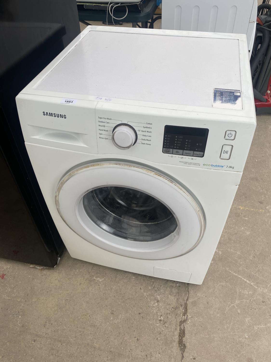 A WHITE SAMSUNG WASHING MACHINE BELIEVED IN WORKING ORDER BUT NO WARRANTY