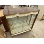 A MID 20TH CENTURY CREAMY WALNUT TWO DOOR CHINA DISPLAY CABINET