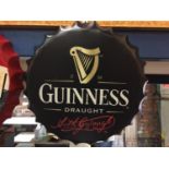 A BOTTLE CAP SHAPED SIGN - DRAUGHT GUINNESS