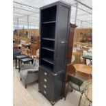 A MODERN BLACK NARROW LOUNGE UNIT WITH DRAWERS TO THE BASE, 25.5" WIDE AND 99.5" HIGH