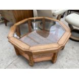 A MODERN OCTAGONAL GLASS TOP COFFEE TABLE WITH SPLIT CANE UNDER-TIER, 36" ACROSS