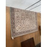 A CREAM PATTERNED 100% SCHURWOLLE BAGDAD RUG (170CM X 240CM)