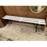 A WOODEN SLATTED AND METAL BASE FOLDING GYM BENCH