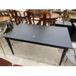 A MODERN BLACK DINING TABLE ON TURNED LEGS, 61" X 34"