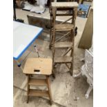 A TWO RUNG WOODEN STEP LADDER AND A FURTHER THREE RUNG VINTAGE WOODEN STEP LADDER