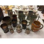 THIRTEEN TANKARDS AND A BRASS VESSEL