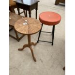 AN OAK WINE TABLE ON TWISTED COLUMN AND TRIPOD BASE WITH LOW STOOL ON TUBULAR BASE