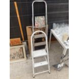 A THREE RUNG STEP LADDER, A FURTHER STEP LADDER AND A PASTING TABLE