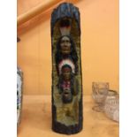 A FAUX LOG WITH RED INDIAN DETAIL A/F