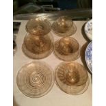 THREE VENETIAN GLASS FINGER BOWLS AND SEVEN PLATES IN A GOLD SWIRL PATTERN WITH PONTIL MARKS