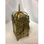 A VINTAGE BRASS LANTERN CLOCK MARKED 'EMPIRE MADE IN ENGLAND 264'