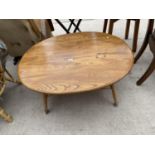 AN OVALOID ELM ERCOL STYLE COFFEE TABLE WITH UNDER TIER, 33" X 39"