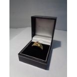 AN 18CT MENS GOLD DIAMOND SOLITAIRE RING WITH A GYPSY SETTING AND APPROXIMATELY 3/4 KARAT