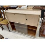 A MID 20TH CENTURY LIMED BUREAU WITH GLASS SLIDING DOORS TO THE BASE, 42" WIDE