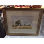 A FRAMED PICTURE OF A HARVEST SCENE