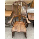 A 19TH CENTURY ELM WINDSOR ROCKING CHAIR