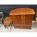 A YEW WOOD TV CABINET AND A NEST OF TABLES