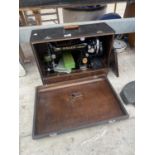 A VINTAGE SINGER SEWING MACHINE WITH CARRY CASE
