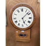 A DECORATIVE INLAID OAK WALL CLOCK