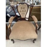 AN EDWARDIAN MAHOGANY LOW OPEN UPHOLSTERED ARMCHAIR WITH BUTTON BACK