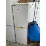 A WHITE HOOVER UPRIGHT FRIDGE FREEZER