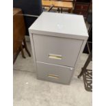 A METAL TWO DRAWER FILING CABINET