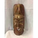 A CARVED WOODEN TRIBAL SENEGALESE 'THE HUNTER' MASK H:48CM