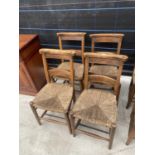 FOUR BEECH FRAMED CHAPEL CHAIRS WITH RUSH SEATS