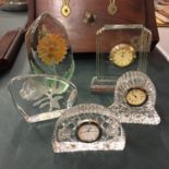 A NUMBER OF CUT GLASS ITEMS TO INCLUDE THREE SMALL CLOCKS AND TWO PAPER WEIGHTS