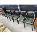 A SET OF SIX REGENCY STYLE DINING CHAIRS WITH BUTTON BACKS AND SEATS, TWO BEING CARVER