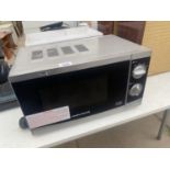 A SILVER MORPHY RICHARDS MICROWAVE OVEN