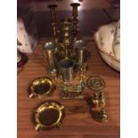 A SELECTION OF BRASSWARE TO INCLUDE CANDLESTICKS AND THREE PEWTER CUPS