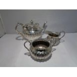 A SMALL SILVER TEAPOT SET