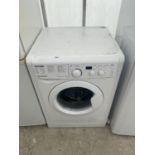 A WHITE INDESIT WASHING MACHINE