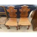 A PAIR OF VICTORIAN MAHOGANY HALL CHAIRS