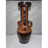 A LARGE MIDDLE EASTERN, POSSIBLY TURKISH, POTTERY TRI HANDLDED WINE VESSEL, HEIGHT 39 CM